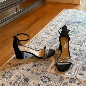 Elegant Black Heels with Silver Embellishments